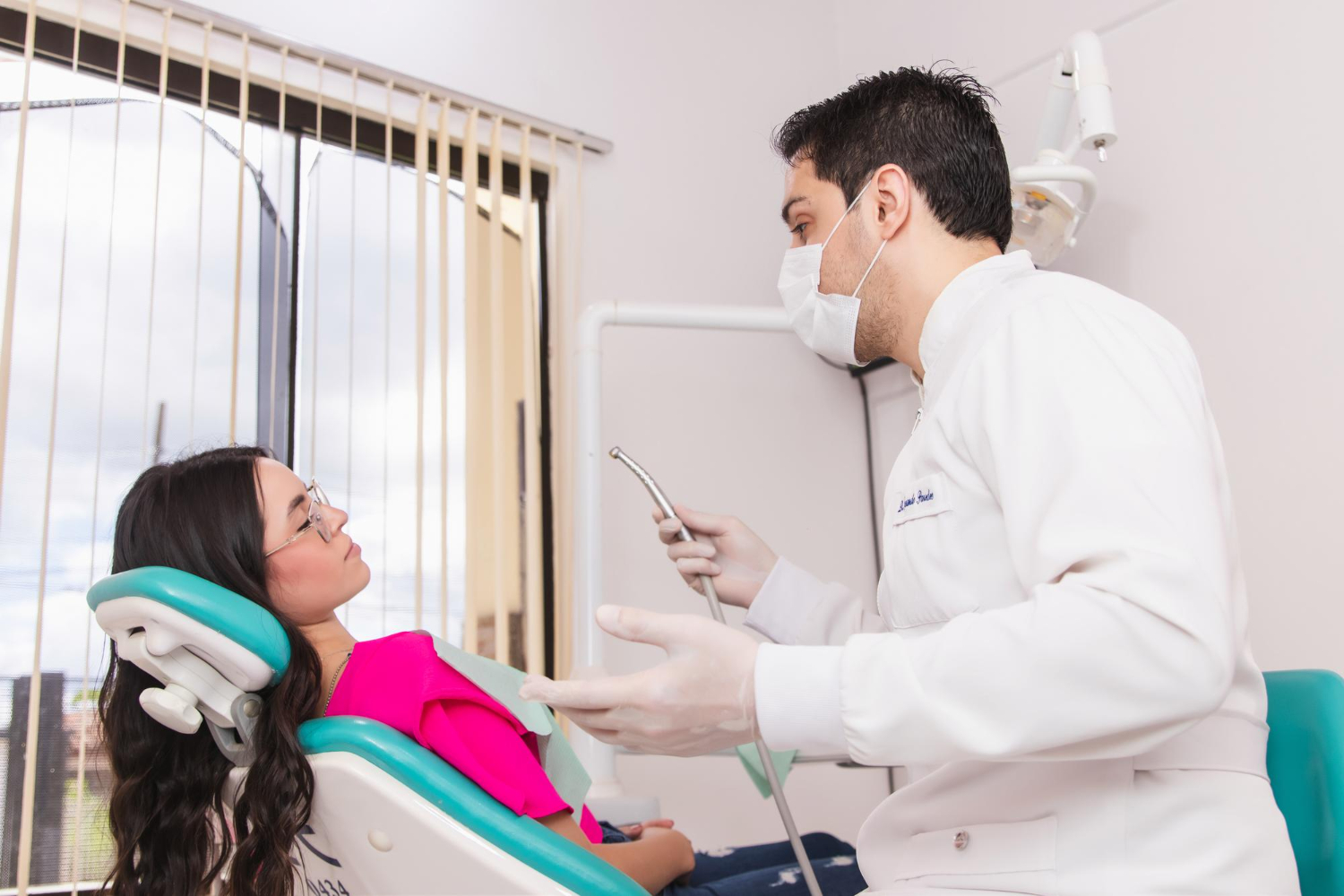 Periodontist discussing gum surgery in Brandywine, MD with a patient during a dental consultation.