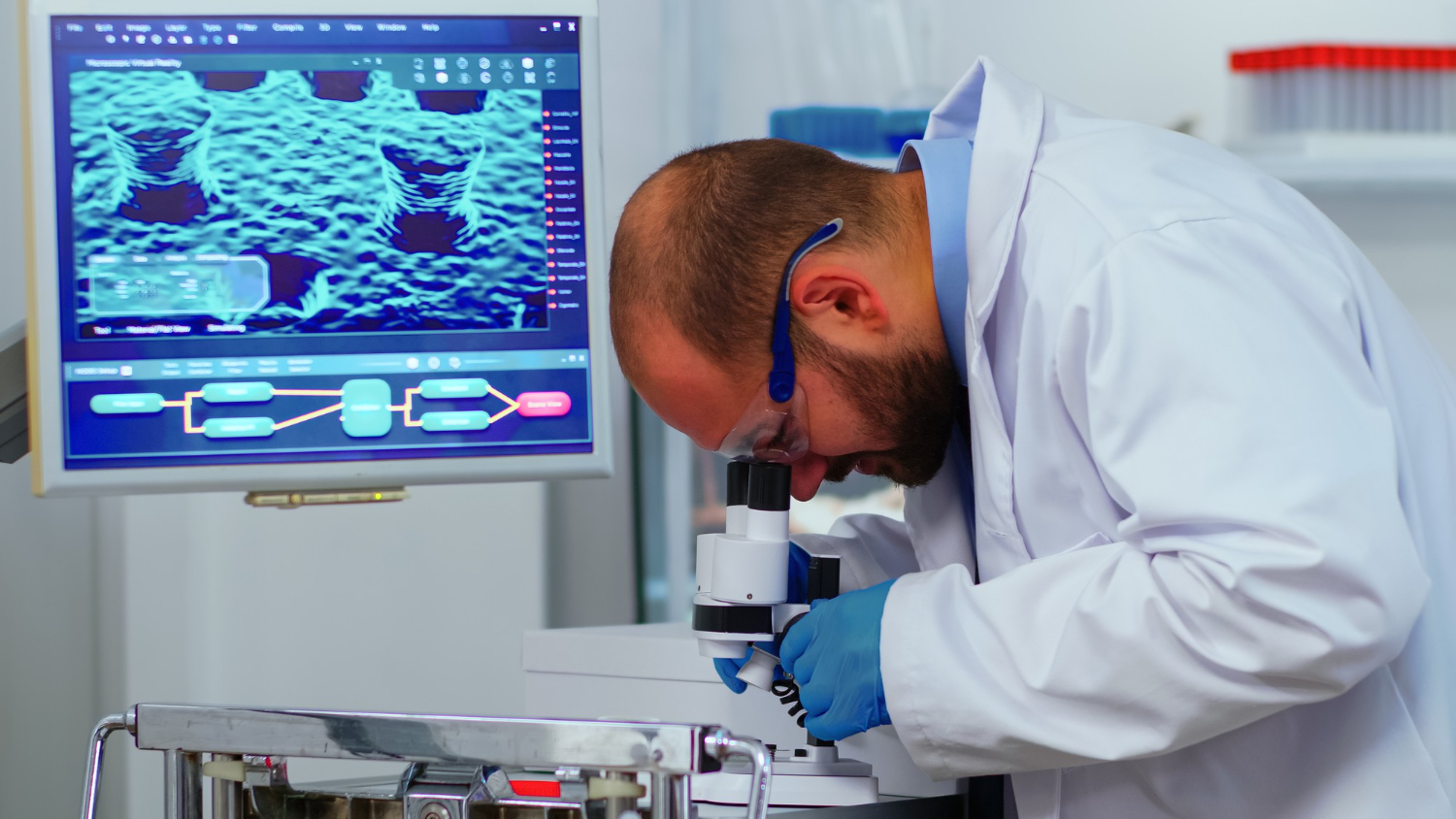 Pathologist examining a biopsy tissue sample under a microscope after an oral biopsy in Brandywine, MD.