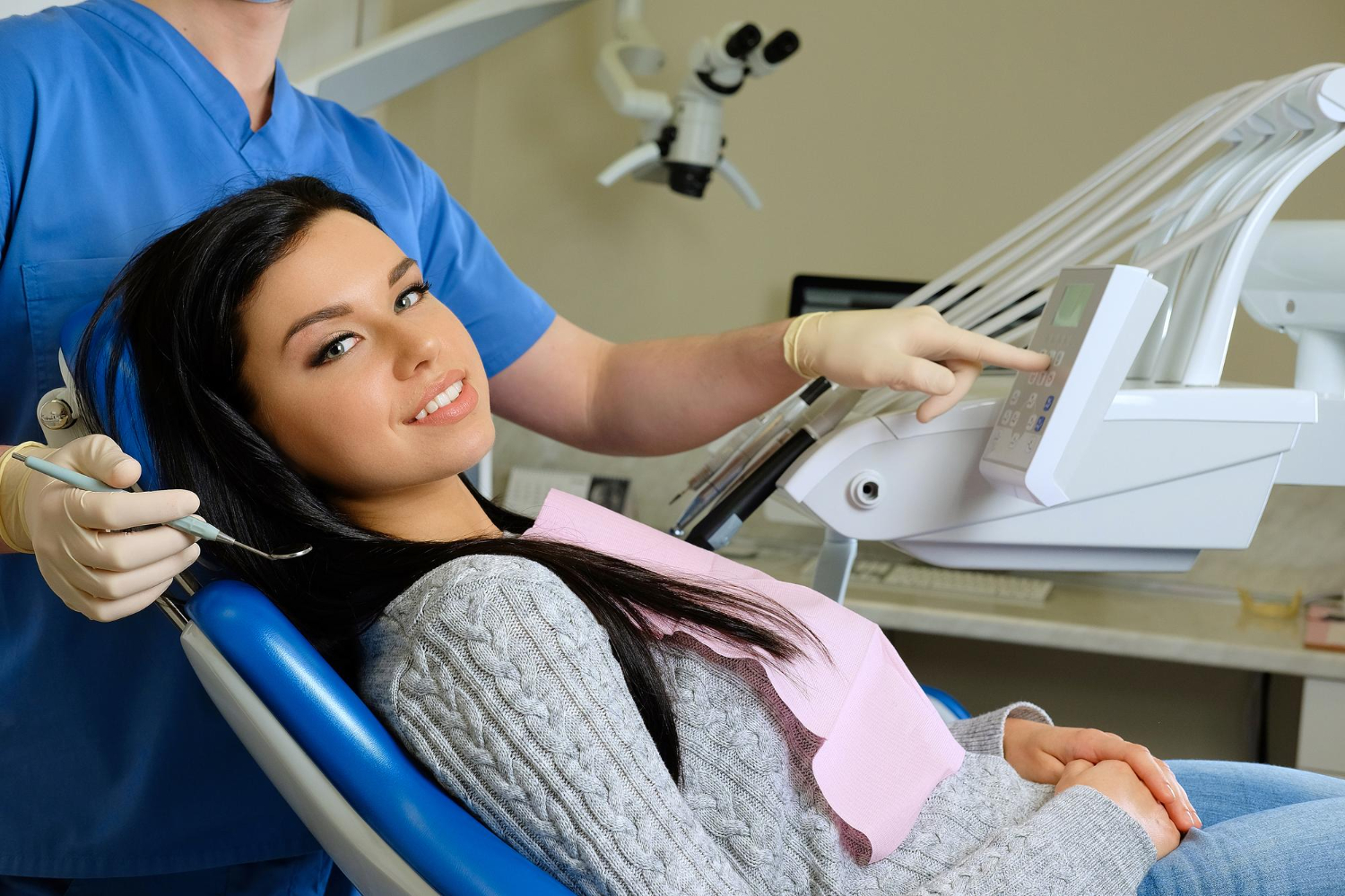 Patient undergoing a comfortable dental scan with an intraoral scanner during a modern dental examination.